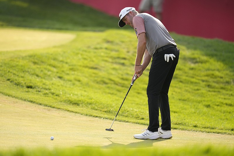 Taylor Pendrith putts on the 18th green during the second round of the 3M Open golf tournament at the Tournament Players Club, Friday, July 26, 2024, in Blaine, Minn. (AP Photo/Charlie Neibergall)