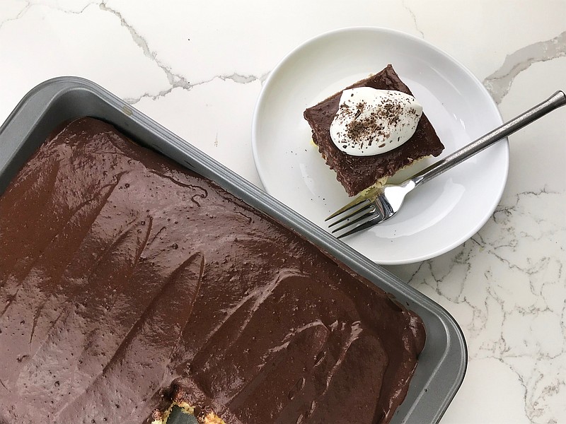 Pudding Poke Cake made with yellow cake and chocolate fudge pudding. 
(Arkansas Democrat-Gazette/Kelly Brant)