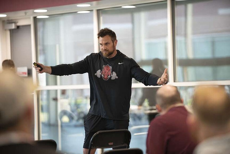 Ben Sowders speaks during a strength clinic Saturday, April 6, at the Fred Smith Center at the University of Arkansas in Fayetteville.