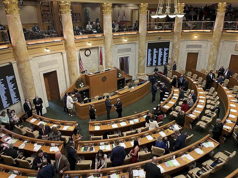 FILE - Arkansas lawmakers gather in the House of Representatives chamber at the state Capitol in Little Rock, Ark. on Monday, Jan. 9, 2023. Arkansas lawmakers are convening at the Capitol and their top agenda item is taking up Gov. Sarah Huckabee Sanders' $6.3 billion proposed budget for the coming year.  (AP Photo/Andrew DeMillo, File)