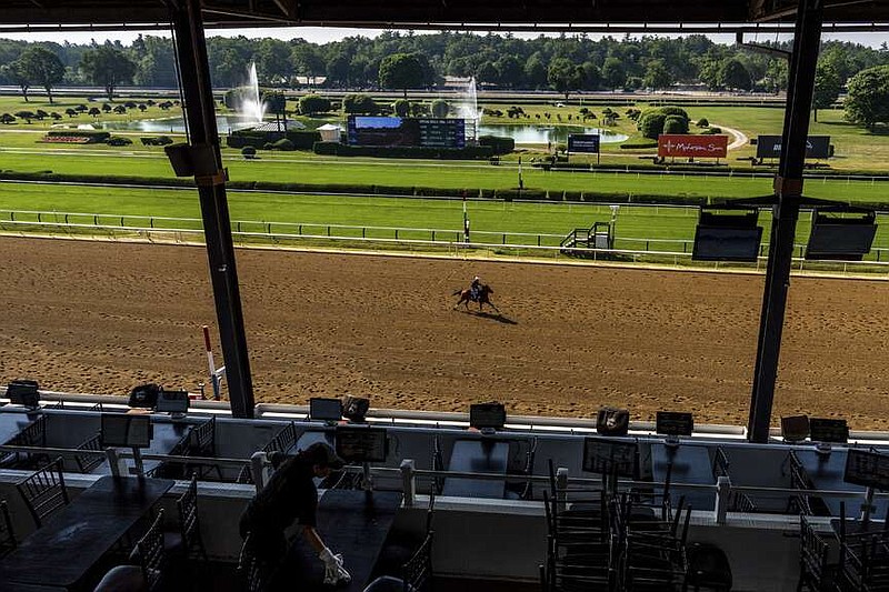 A horse works out ahead of the 156th running of the Belmont Stakes horse race at Saratoga Race Course, Wednesday, June 5, 2024, in Saratoga Springs, N.Y. (AP Photo/Julia Nikhinson)