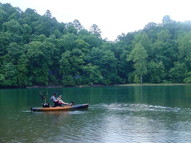 Fishing from a kayak in a light rain on a warm day can be a refreshing way to experience the beauty of Van Winkle Hollow on Beaver Lake. Visit nwaonline.com/photo for today's photo gallery.
(NWA Democrat-Gazette/Flip Putthoff)