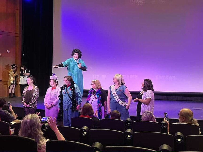 The cast of "The Rocky Horror Picture Show" pose for photos at the July 20 screening of the movie at the Ron Robinson Theater.