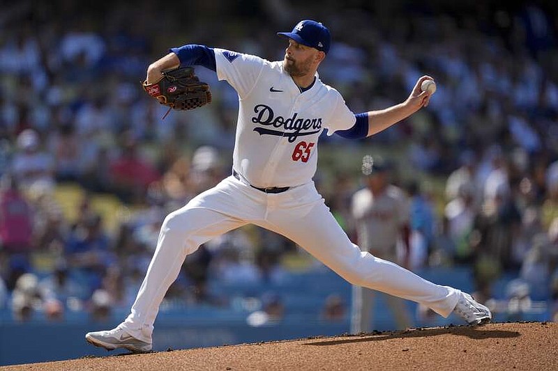 Los Angeles Dodgers starting pitcher James Paxton throws during the first inning of a baseball game against the Boston Red Sox, Sunday, July 21, 2024, in Los Angeles. (AP Photo/Ryan Sun)