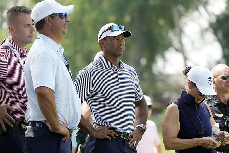 Tiger Woods watches his son Charlie Woods play during the first round of stroke play of the U.S. Junior Amateur Golf Championship, Monday, July 22, 2024, in Bloomfield Township, Mich. (AP Photo/Carlos Osorio)