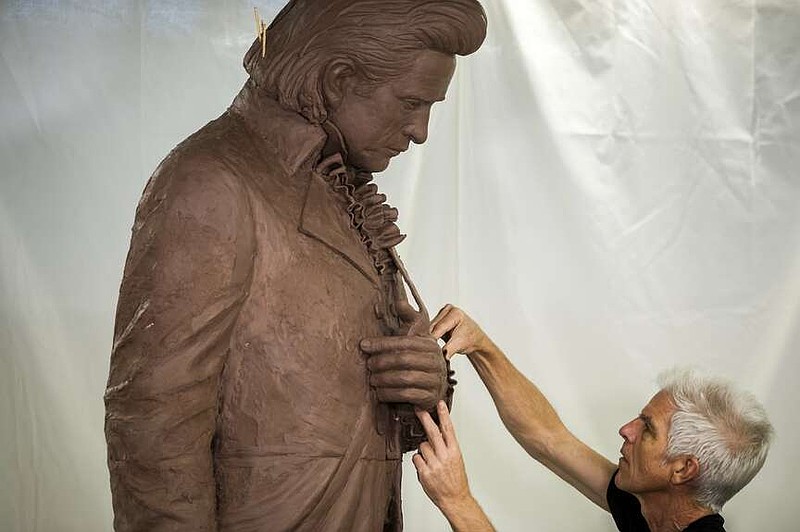 FILE - Kevin Kresse works on his sculpture of Johnny Cash at UA Little Rock's Windgate Center of Art and Design on Tuesday, July 26, 2022. (Arkansas Democrat-Gazette/Stephen Swofford)