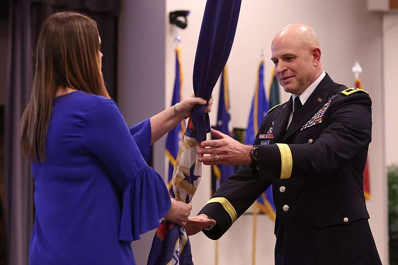 Arkansas National Guard Major General Jonathan M. Stubbs, right, accepts the Department of the Military Command Colors from Gov. Sarah Huckabee Sanders during an Assumption of Command Ceremony at Camp Robinson on Saturday, March 4, 2023. (Arkansas Democrat-Gazette/Colin Murphey)