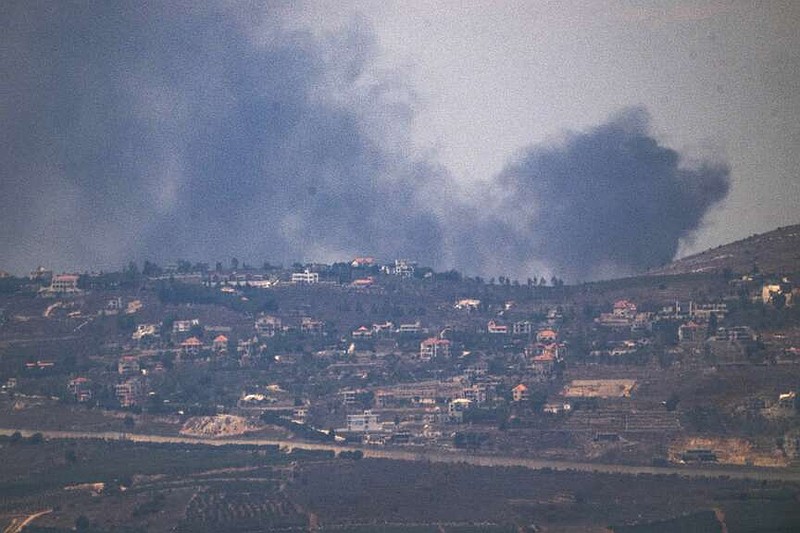 Smoke rises after a strike in an area in Lebanon next to the Israeli-Lebanese border at the Galilee region, as seen from the Israeli-annexed Golan Heights, Sunday, Aug. 4, 2024. (AP Photo/Leo Correa)