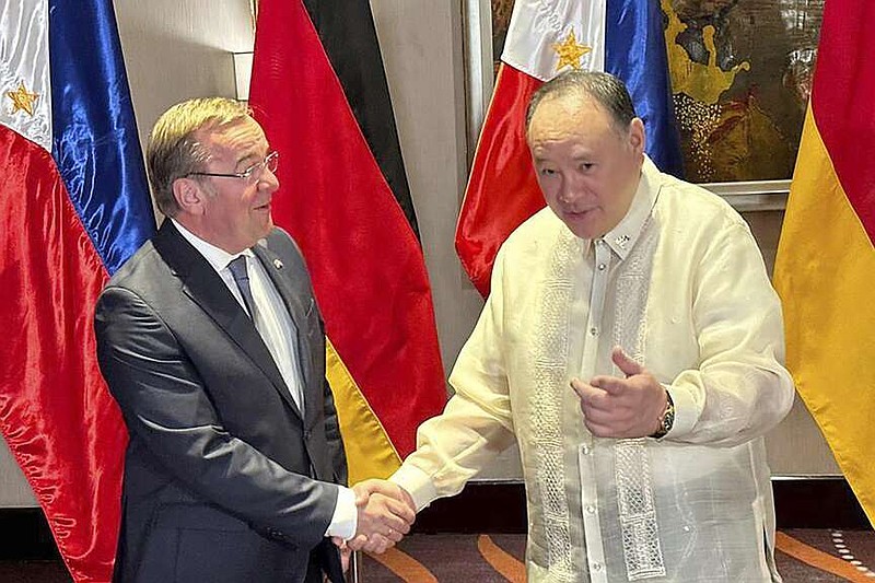 German Defense Minister Boris Pistorius, left, meets with his Philippine counterpart Gilberto Teodoro, Jr. in Manila, Philippines, Sunday, Aug. 4, 2024. (AP Photo/Joeal Calupitan)