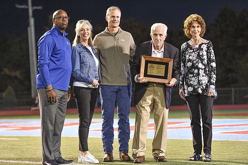 In this file photo Jim Rowland (second from right), longtime athletic director for Fort Smith Southside, is honored, Friday, Sept. 30, 2022, before the start of the second quarter of Bentonville’s 48-14 win over the Mavericks at Jim Rowland Stadium in Fort Smith. 
(NWA Democrat-Gazette/Hank Layton)