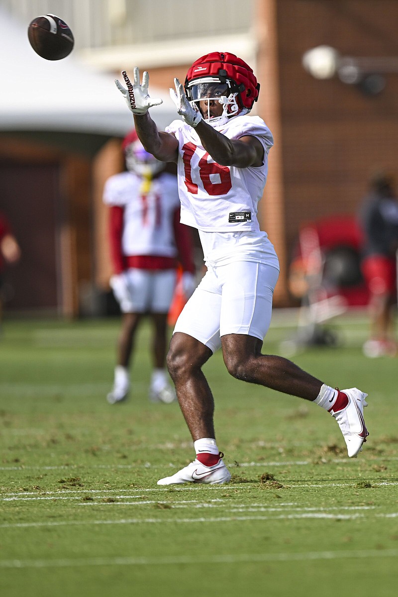 Arkansas wide receiver Krosse Johnson catches a pass Wednesday during the Razorbacks’ first preseason practice at the Walker Pavilion in Fayetteville.
(NWA Democrat-Gazette/Hank Layton)