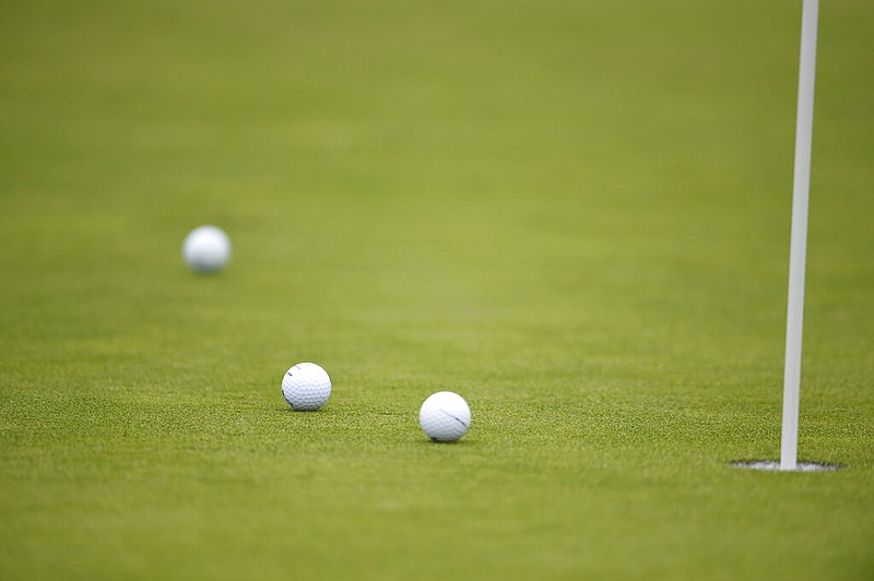 FILE — Golf balls sit on a course in this 2020 file photo.