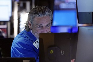 FILE - Trader John Romolo works on the floor of the New York Stock Exchange, Aug. 2, 2024. Japan's benchmark Nikkei 225 stock index has lost 12.4% on Monday, August 5, 2024, in the latest bout of sell-offs that are jolting world markets. (AP Photo/Richard Drew, File)