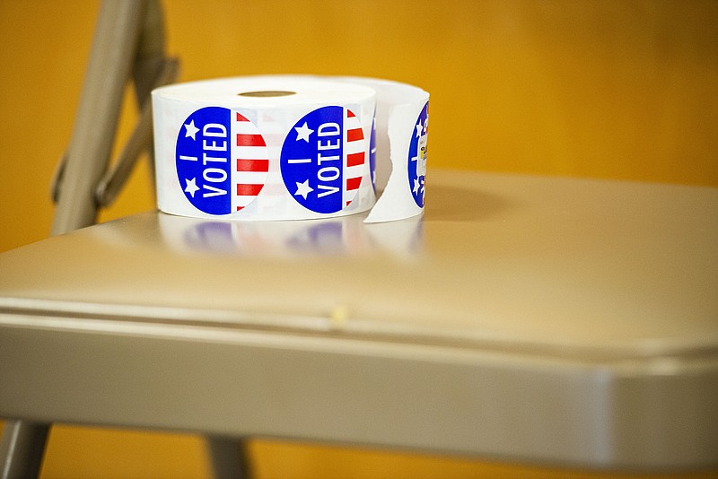 A roll of voting stickers is seen on Election Day, Tuesday, May 24, 2022, at the Elm Grove Community Center at Martin Luther King Jr. Park in Fort Smith. Voters in Sebastian County cast their ballots for several primary, county, city and school board races, as well as special tax elections. 
(NWA Democrat-Gazette/Hank Layton)