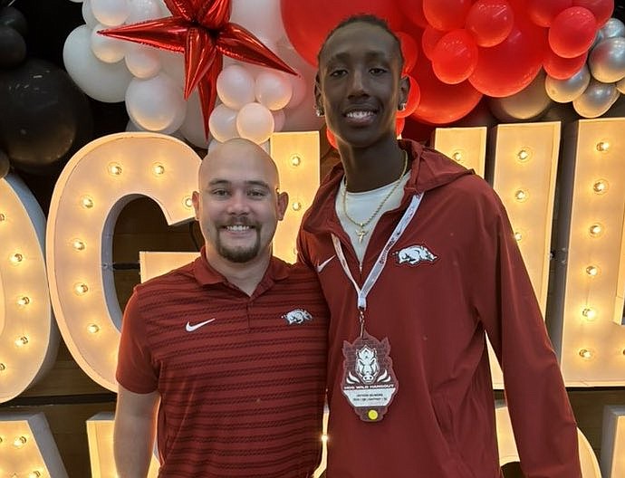 Arkansas assistant quarterback coach Miles Fishback and quarterback Jayvon Gilmore during the July 27 Hogwild Hangout.