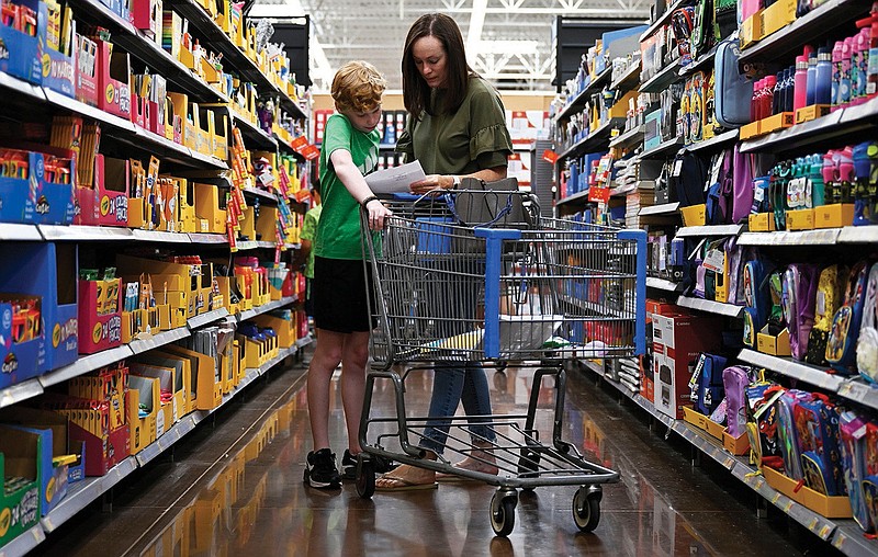 FILE - Julia Harrison shops for back to school supplies with her son, Will, 10, as they prepare for will to start 5th grade at Walmart in Little Rock on Tuesday, Aug. 1, 2023. (Arkansas Democrat-Gazette/Stephen Swofford)