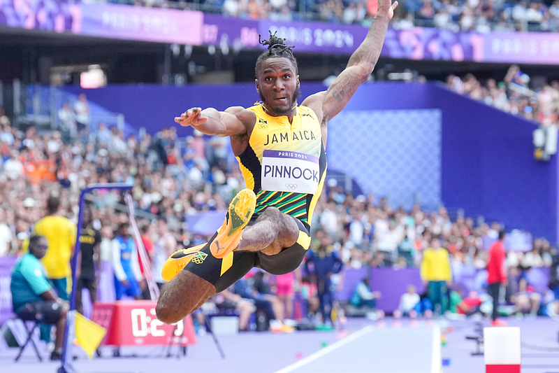 Arkansas senior jumper Wayne Pinnock, of Jamaica, competes in the men's long jump qualification at the 2024 Summer Olympics, Sunday, Aug. 4, 2024, in Saint-Denis, France. (Shawn Price/Arkansas Athletics)